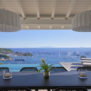 Savor breakfast while taking in stunning ocean views from your private terrace, where tropical waters meet endless blue sky.