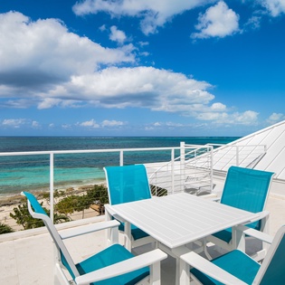 Dine alfresco at your private terrace with stunning ocean views and tropical breezes as your backdrop.