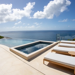 Unwind on your private terrace with infinity pool and hot tub, where endless ocean views create the perfect backdrop for pure relaxation.