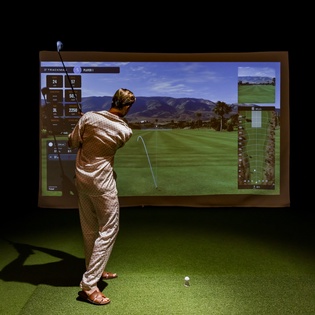 Perfect your swing in this state-of-the-art golf simulator, where you can play world-class courses year-round.