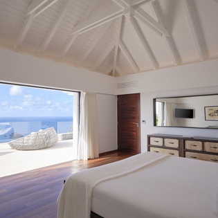Wake to endless ocean views from your luxurious bedroom. Feel the gentle sea breeze flow through your private terrace.