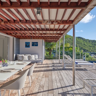 Soak up sunshine on your private deck with stunning mountain views, pool access, and seamless indoor-outdoor living.