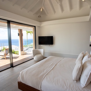Wake up to breathtaking ocean views from your luxurious bed, where panoramic sea vistas stretch endlessly beyond your private terrace.