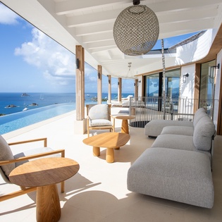 Unwind on your private terrace with stunning sea views, infinity pool, and luxurious seating perfect for morning coffee or sunset cocktails.