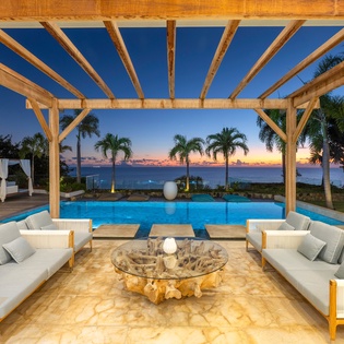 Unwind in your private poolside paradise as tropical sunsets paint the sky beyond infinity waters.