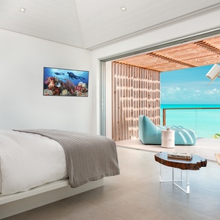 Wake up to crystal-clear turquoise waters from your luxurious suite, where modern comfort meets tropical paradise right at your doorstep.