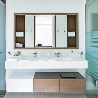 Indulge in luxury with this stunning double-vanity bathroom featuring sleek modern design and premium finishes for your ultimate comfort.