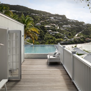 Step onto your private deck where infinity pool meets tropical paradise, perfect for morning coffee or sunset relaxation.