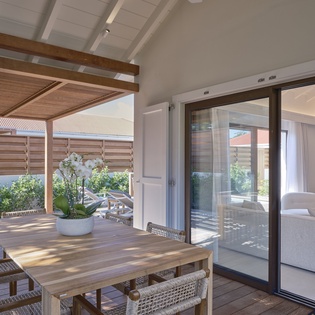 Your private terrace seamlessly flows into the bright living area, creating the perfect indoor-outdoor retreat for dining and relaxing.