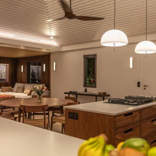 Relax in your open-plan kitchen and dining space, where warm wood tones and modern fixtures create the perfect atmosphere for memorable meals.