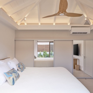 Drift off under your private vaulted ceiling with exposed beams, while gentle breezes from your ceiling fan keep you cool and comfortable.