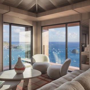 Sink into plush seating while breathtaking ocean views fill every window of your sophisticated living space.