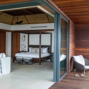 Relax in your expansive suite where indoor luxury meets outdoor paradise, with stunning ocean views from your private terrace.