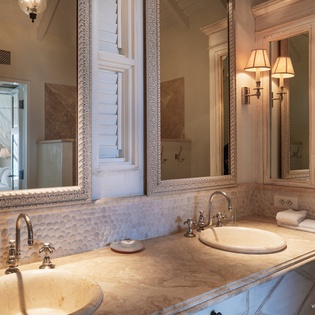 Your elegant bathroom features dual marble vanities, plush towels, and thoughtful ambient lighting. Classic design meets modern comfort in this beautifully appointed space.
