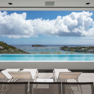 Stunning infinity pool with panoramic ocean views and luxury loungers for the ultimate Caribbean escape.