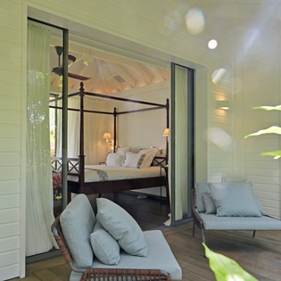 Your private balcony retreat connects seamlessly to your elegant four-poster bedroom, creating a perfect indoor-outdoor sanctuary.