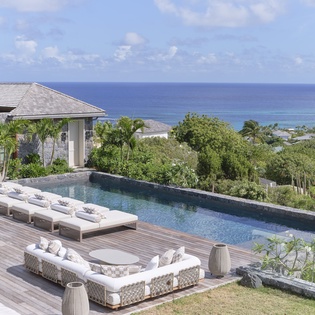 Relax by your private infinity pool with stunning sea views stretching to the horizon from this luxurious tropical retreat.