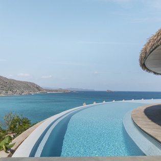 Your private infinity pool seamlessly blends with turquoise ocean views, creating the perfect tropical paradise for relaxation.