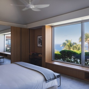 Wake up to stunning tropical views with swaying palms and blue ocean just outside your window.