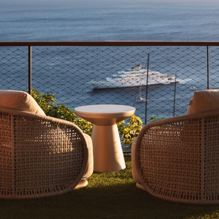 Settle into these cozy wicker chairs and soak in breathtaking ocean views from your private terrace retreat.