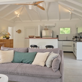 Unwind in this bright open-plan space where your living area flows seamlessly into the modern kitchen, perfect for gathering.