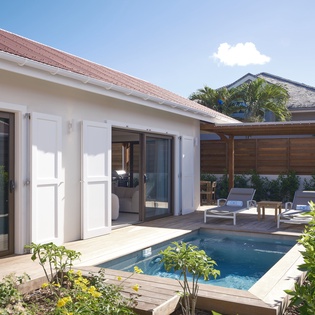 Your private paradise awaits with an intimate plunge pool, sun loungers on warm decking, and lush tropical gardens creating your perfect outdoor sanctuary.