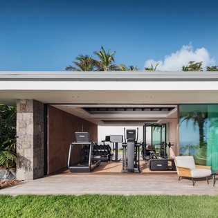 Stay fit during your tropical getaway with your private outdoor gym surrounded by lush palms and endless blue skies.