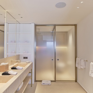 Unwind in your elegant bathroom featuring a spacious dual vanity, luxurious amenities, and premium finishes for ultimate relaxation.