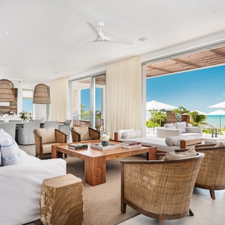 Unwind in your bright, airy living space with stunning ocean views through floor-to-ceiling windows.