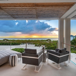 Modern terrace with stunning sea and sunset views. Your perfect spot to unwind with panoramic ocean vistas.