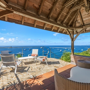 Stunning sea view gazebo where you'll unwind with panoramic ocean vistas and boats dotting the azure waters below.