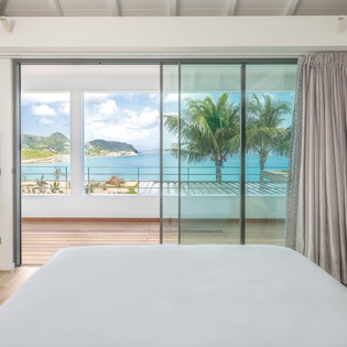 Wake up to stunning ocean views from your bed, with turquoise waters and swaying palms just beyond your private balcony.
