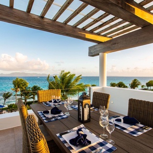 Savor al fresco dining on your private terrace, where tropical breezes and stunning ocean panoramas create the perfect backdrop for unforgettable meals under an open sky.