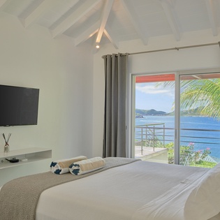 Wake up to breathtaking ocean views from your bed, where tropical breezes and turquoise waters create the perfect island escape.