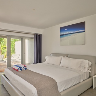 Wake up to ocean breezes through your private terrace doors. Crisp white linens and modern comfort await your restful nights.