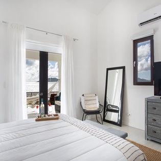 Sunlight streams through your window, highlighting the crisp linens and modern comforts. Step out to your private balcony and let the ocean breeze refresh your senses.