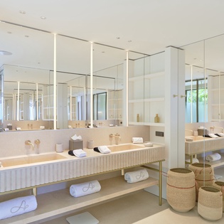 Step into your spa-like bathroom with dual vanities, luxurious marble surfaces, and thoughtful touches that make every morning feel indulgent.