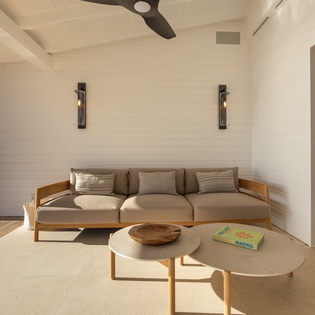 Relax on your private covered terrace where natural wood meets modern comfort, with tropical breezes flowing through.