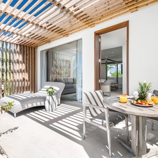 Relax on your private terrace where tropical breezes and dappled shade create the perfect outdoor retreat for morning coffee or evening meals.