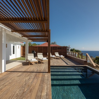 Dive into your private infinity pool while soaking up breathtaking ocean views from this stunning seaside terrace.