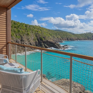 Relax on your private oceanfront terrace with stunning turquoise waters stretching endlessly before you.