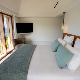 Wake up to breathtaking ocean views from your comfortable bed, with crisp linens and panoramic windows framing the endless blue horizon.