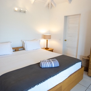 Sink into your comfortable bed with crisp linens and soft lighting creating the perfect atmosphere for restful nights.