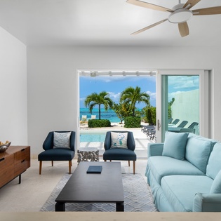 Your bright living space opens to stunning ocean views and a private pool, where soft sea breezes flow through.