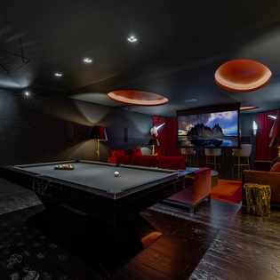 Unwind in your private game room with pool table, big screen, and luxurious seating—perfect for memorable evenings with friends.