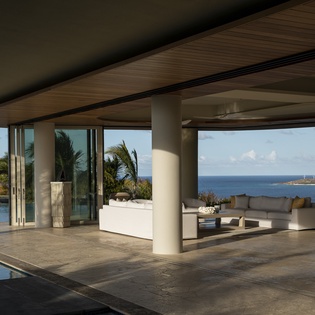 Step into your open-air sanctuary where modern luxury meets tropical paradise, with stunning ocean vistas framing your private poolside retreat.