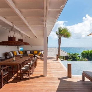 Dine al fresco beneath soaring ceilings as tropical breezes drift through this stunning covered terrace. Your private infinity pool and endless ocean views create the perfect backdrop for unforgettable island moments.