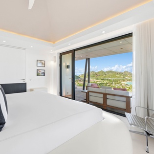 Wake up to stunning mountain and sea views from your luxurious master suite with seamless indoor-outdoor living.