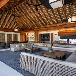 Picture yourself unwinding in this stunning open-air pavilion, where soaring wood beams and elegant design create the ultimate gathering space for memorable moments with loved ones.