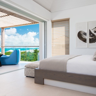 Wake up to breathtaking turquoise waters from your luxurious bedroom, where the ocean becomes your private backdrop for ultimate relaxation.